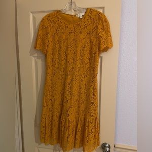 Beautiful lace party dress from Michael Kors.  Knee length.